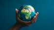 © Ricardo Costa - Hand holding a blue earth globe