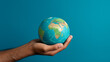 © Ricardo Costa - Hand holding a blue earth globe