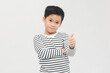 © makistock - Asian boy showing thumbs up gesture, isolated on white background. banner