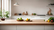 © Nisit - Wooden light empty table top in modern white kitchen and blurred background