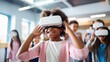 © Oulaphone - Surprised of Multicultural students with virtual reality headset in classroom