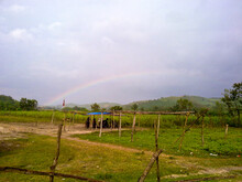 Tranquil Countryside Rainbow Over Blue Sky