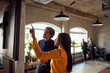 © Maskot - Businesswoman gesturing while discussing with businessman at creative office