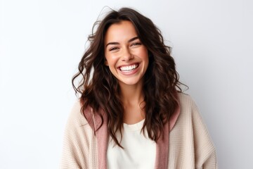 Wall Mural - Portrait of a happy young woman smiling at camera over white background