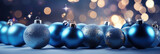 Fototapeta  - blue christmas balls on a bokeh background