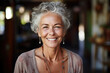 close up portrait of an mindful mature woman smiling in camera