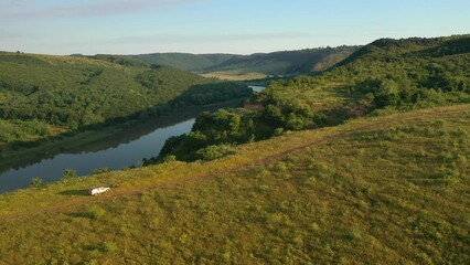 Poster - Aerial footage of a majestic river flowing through a hilly area. Dniester Canyon, Ukraine, Europe.