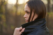 © spaxiax - woman is wearing black leather jacket in the autumn park