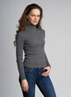 © spaxiax - woman is wearing a sweater isolated on grey