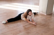 young girl doing leg-split stretching in the studio, dancer doing practice