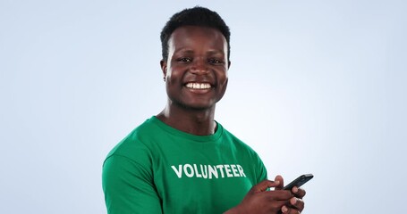 Wall Mural - Volunteer face, phone and happy black man on charity outreach website, community service blog or NGO social media. Cellphone, recycling support and studio portrait of eco activist on blue background