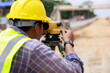 © SHUTTER DIN - Close up Engineer use theodolite equipment for route surveying to build a bridge