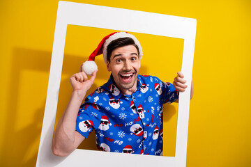 Canvas Print - Photo frame celebrate magic night happy new year party location young student guy touch pom pom hat isolated on yellow color background