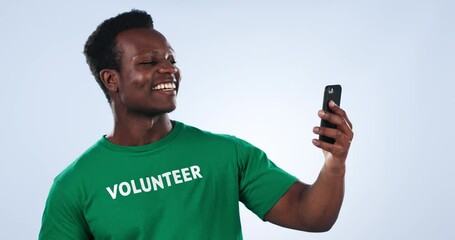 Poster - Black man, phone and volunteer video call, talking or consulting for charity recruitment, eco support or NGO membership. Cellphone, social responsibility chat and studio activist on blue background