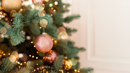 Wall Mural - Christmas tree branches with decorations, balls, garlands, bokeh. Postcard with space for text.