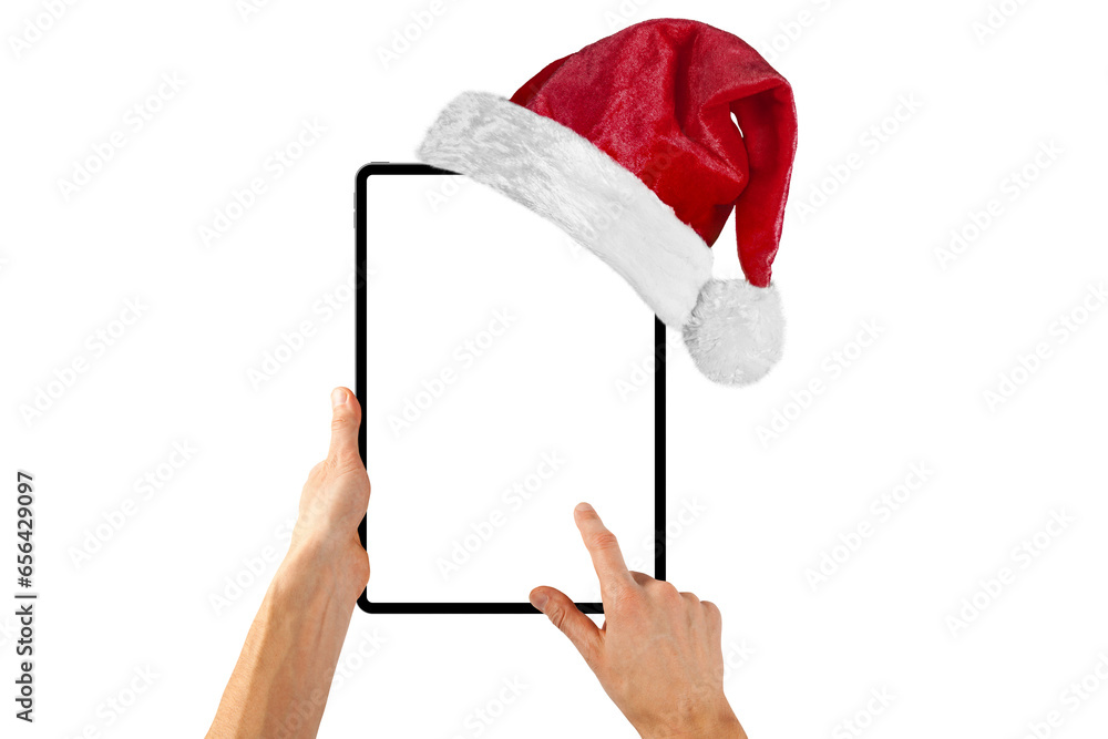 tablet computer isolated with a Santa Claus hat for Christmas on a ...