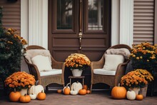 Front Porch Adorned With Autumn Decor, Including Pumpkins And Flowers, Welcoming The Fall Season