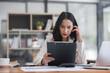 © wichayada - Puzzled confused asian woman thinking hard concerned about online problem solution looking at laptop screen, worried serious asian businesswoman focused on solving difficult work computer task