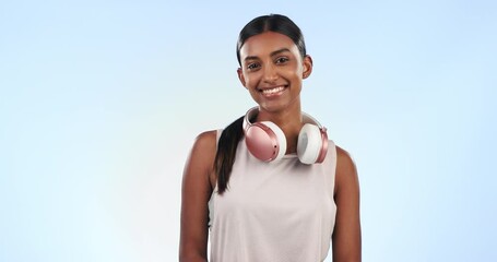 Wall Mural - Fitness, face and woman with watch in studio for checking time or pulse for cardio workout. Wellness, sports and portrait of Indian athlete for running exercise or training by blue background.