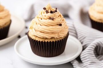 Sticker - a chocolate cupcake with a dollop of peanut butter frosting