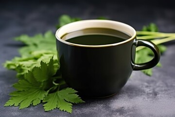 Poster - dark porcelain cup with steaming nettle tea on a stone countertop