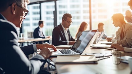 Businessmen blur in the workplace or work space of table work in office with computer