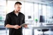 © BillionPhotos.com - professional young business man hold digital tablet, AI generated image