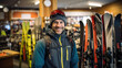 Man picks out ski equipment for the mountains at the store