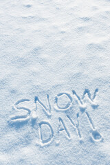 somebody wrote snow day in the freshly fallen snow on cold winter morning. schools and or work place