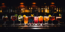 Variety Of Alcoholic Drinks And Multi Colored Cocktails On The Reflective Surface Of Bar Counter. Blurred Shelves With Bottles On Background. AI Generative.