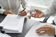 © Charlie's - Business people signing contract making deal with real estate agent Concept for consultant home insurance.Real estate investment Property insurance security. Real estate agent offer house.