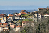 Fototapeta Uliczki - Aerial view of dense historic center of Thiers town in Puy-de-Dome department, Auvergne-Rhone-Alpes region in France. Rooftops of old buildings and narrow streets