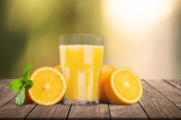 Wall Mural - Fresh sweet orange juice in glass on table