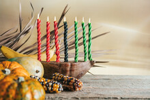 Kwanzaa, African Holiday Kwanzaa With Decoration Of Seven Candles In Red, Black And Green Colors, Vegetable Harvest, Corn. Greeting Card Banner. Happy Kwanzaa