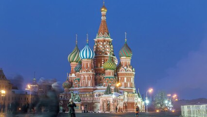 Wall Mural - Timelapse capturing the transition from winter day to night at Red Square in Moscow, Russia, with the illuminated Cathedral of St. Basil.