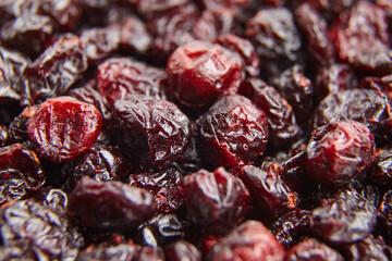 Wall Mural - Dried cranberries texture food background. Heap of red autumn berries closeup