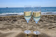 Summer time in Provence, two glasses of cold champagne cremant sparkling wine on famous Pampelonne sandy beach near Saint-Tropez in sunny day, Var department, France