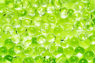 Wall Mural - Round shape pattern. Green glass balls. Crystal spheres texture. Glittering circles background. Bubble background. Shiny objects. Glossy balls background.