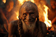 A wiry old man, his weatherbeaten face etched with lines of laughter and hardship. He sits crosslegged in front of a fire, surrounded by a circle of fellow tribespeople, representing generations