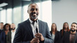 © Tierney - African american businessman giving a speech at conference
