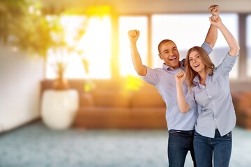 Poster - Happy young couple having fun at home in room