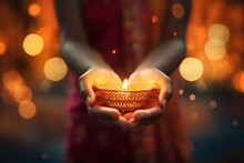 Indian Woman Holding Diwali Oil Lamp In Hand With Bokeh Background