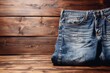 Classic jeans elegantly presented against a textured wooden background