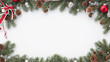 Christmas background with fir tree branches, red decorations and snow. Top view with copy space.