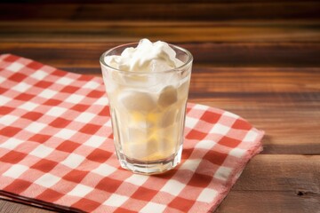 Canvas Print - a glass of cream soda on a checkered cloth