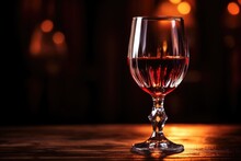 A Shiny Glass Filled With Port Wine Under Soft Light
