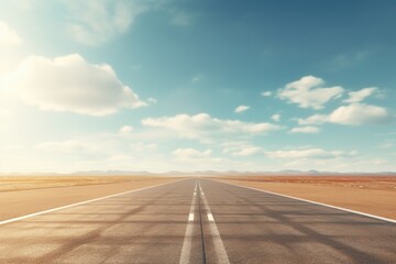 Wall Mural - A picture of an empty road stretching through the vast desert. Perfect for illustrating the concept of isolation and adventure.