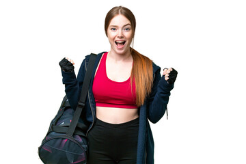 Wall Mural - Young sport woman with sport bag over isolated chroma key background celebrating a victory in winner position