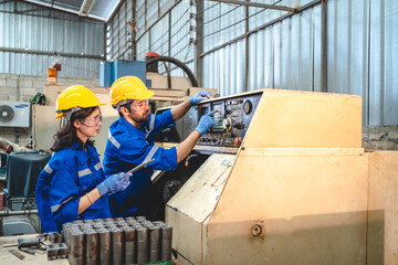 Wall Mural - professional technician engineer checking mechanical factory equipment for using on industry machine, foreman with safety hard hat helmet working to maintenance control production job in manufacturing