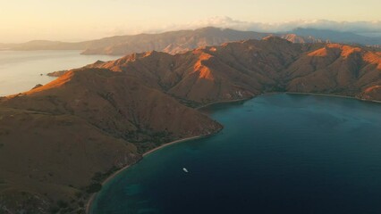 Wall Mural - Aerial view of the Komodo island at sunrise. Komodo National Park in Indonesia